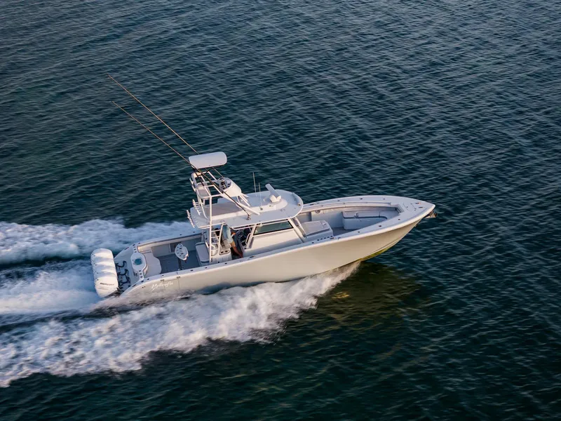 Slide: The Image of 2022 Yellowfin 42 boat cruising on open water. - 9