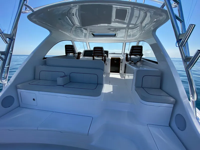 Slide: The Image of 2025 Mag Bay 42 yacht interior with seating and helm station. - 11