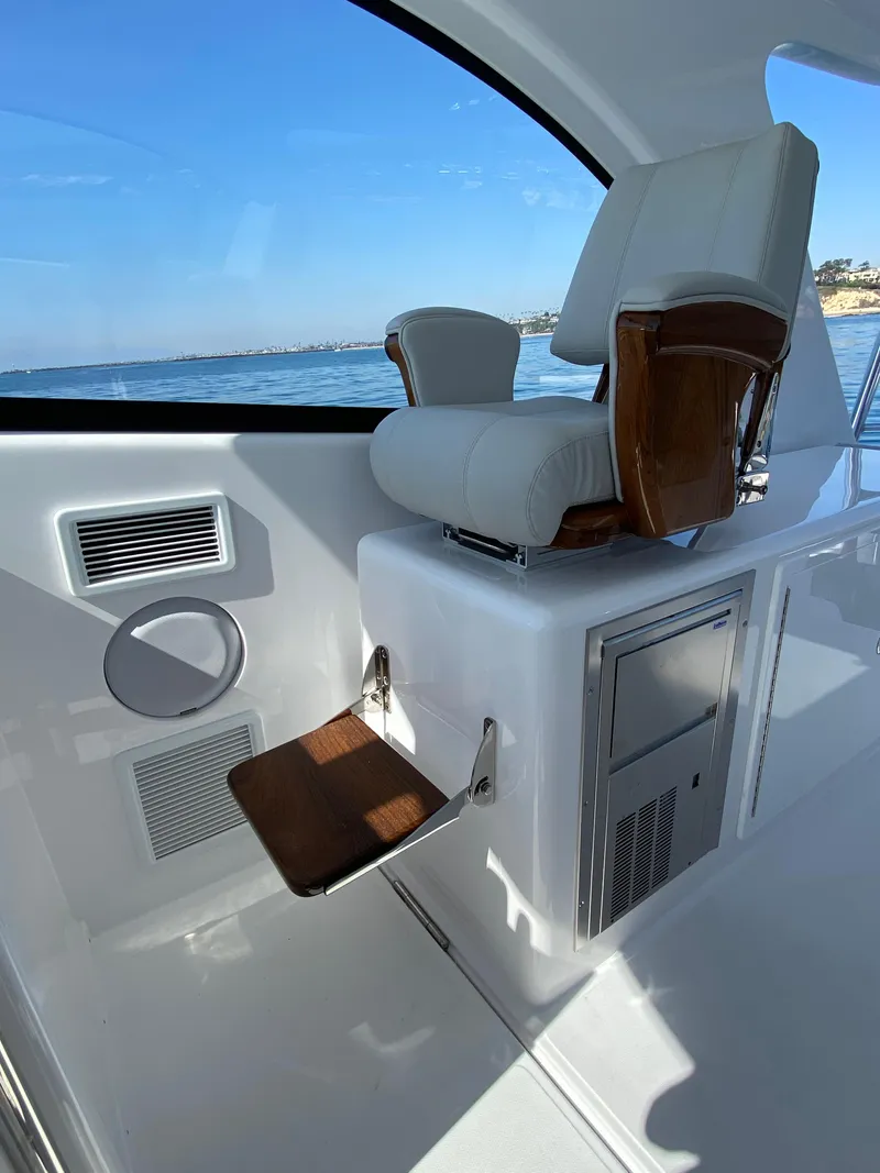 Slide: The Image of Captain's chair on the 2025 Mag Bay 42 yacht with ocean view. - 15