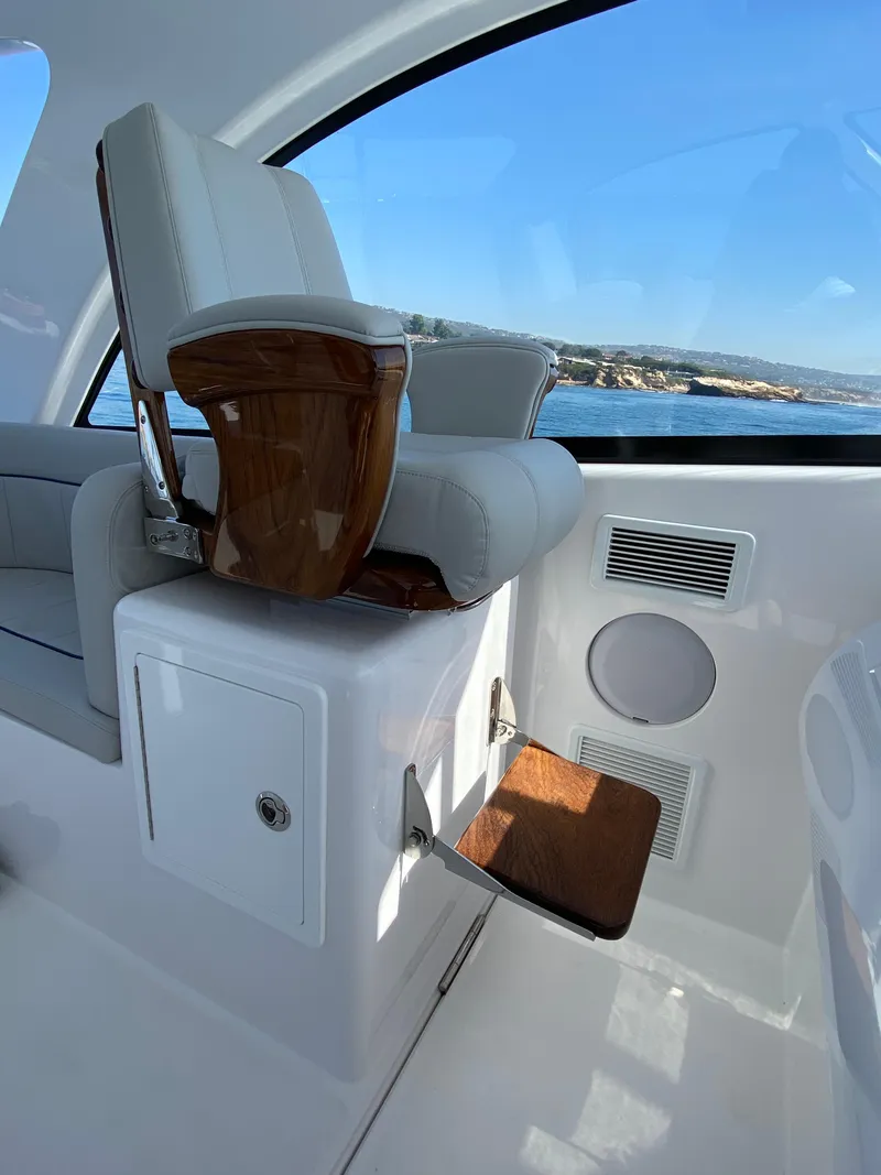 Slide: The Image of Captain's chair on the 2025 Mag Bay 42 yacht with ocean view. - 16