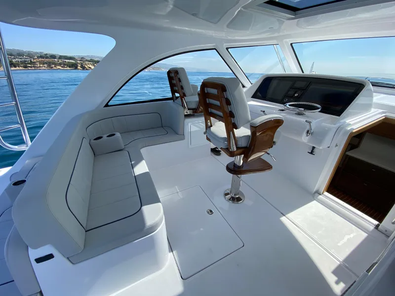 Slide: The Image of Interior of 2025 Mag Bay 42 yacht with seating and helm station. - 17