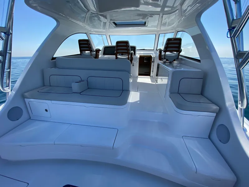 Slide: The Image of 2025 Mag Bay 42 boat interior with seating and ocean view. - 18