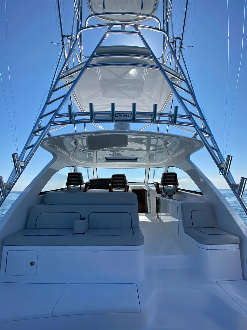 Slide: The Image of 2025 Mag Bay 42 yacht interior with seating and helm station. - 19