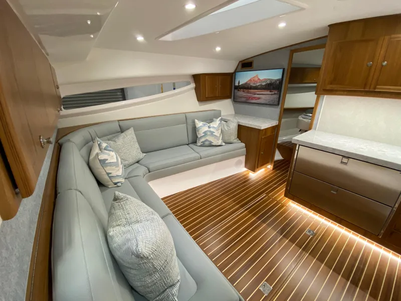 Slide: The Image of Luxurious interior of 2025 Mag Bay 42 yacht with modern furnishings and wood flooring. - 21