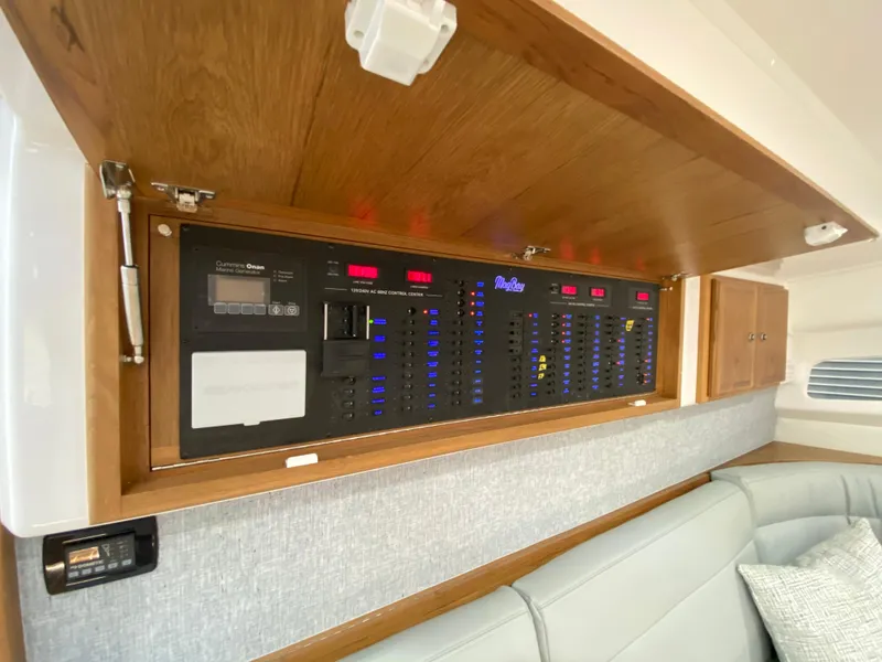 Slide: The Image of Electrical control panel inside 2025 Mag Bay 42 yacht, featuring modern design and comfortable seating. - 29