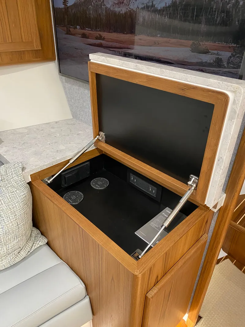 Slide: The Image of Open storage compartment in 2025 Mag Bay 42 yacht interior. - 30