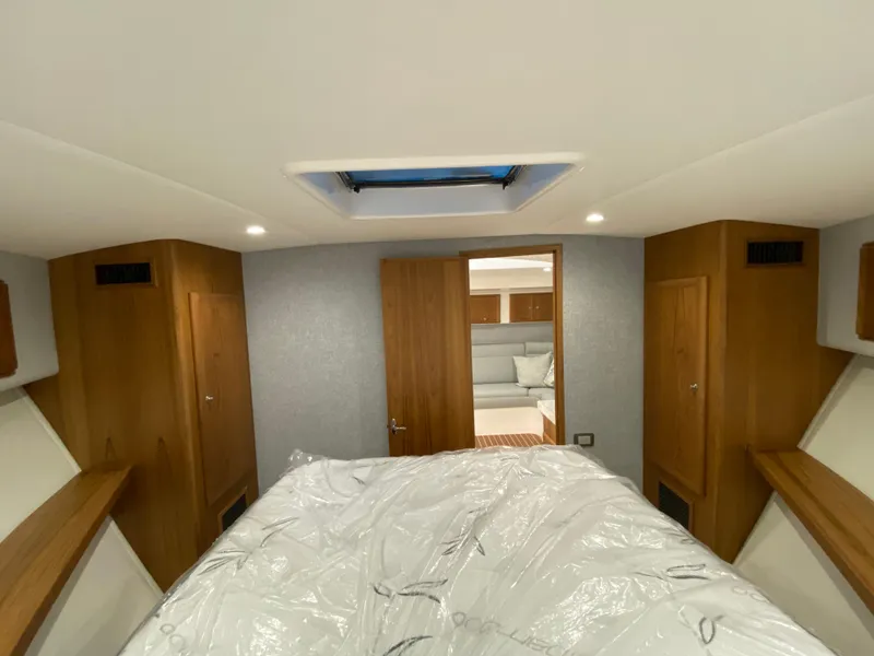 Slide: The Image of Interior cabin of 2025 Mag Bay 42 yacht with bed and wooden cabinetry. - 33