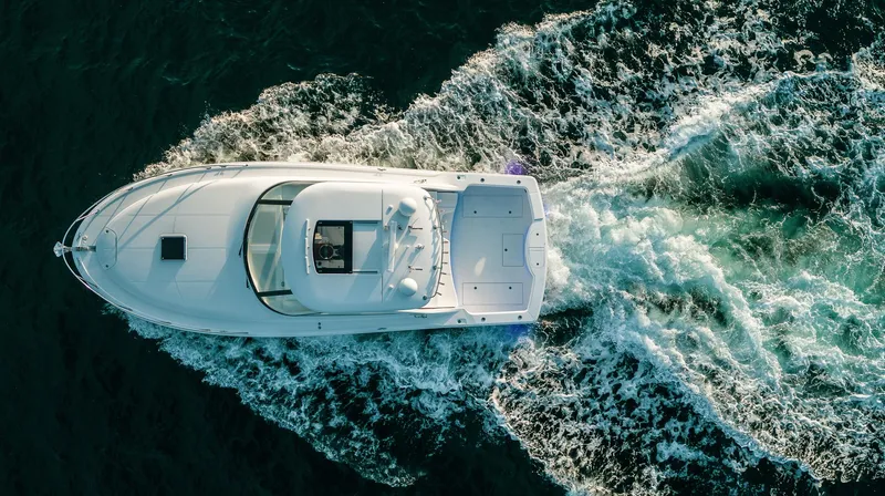 Slide: The Image of Aerial view of 2025 Mag Bay 42 yacht cruising on open water. - 7