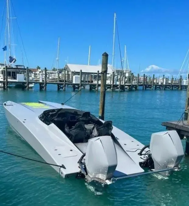 Slide: The Image of 2021 HellKats 320X powerboat docked in a marina. - 4