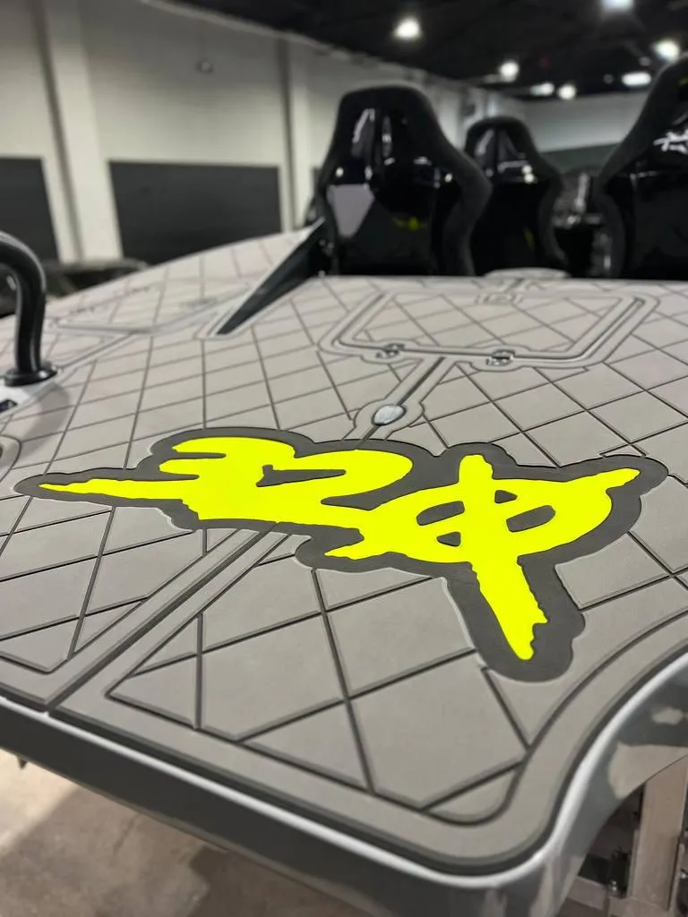 Slide: The Image of 2021 HellKats 320X interior with yellow logo and diamond-patterned design. - 6