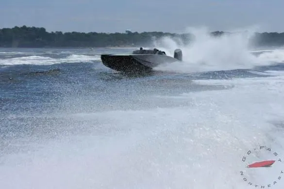 Slide: The Image of HellKats 320X 2021 speedboat racing on water, creating large splashes. - 9