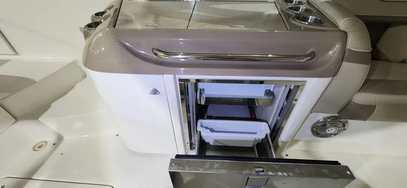 Slide: The Image of 2015 Formula 350 CBR boat interior with open storage compartments. - 10