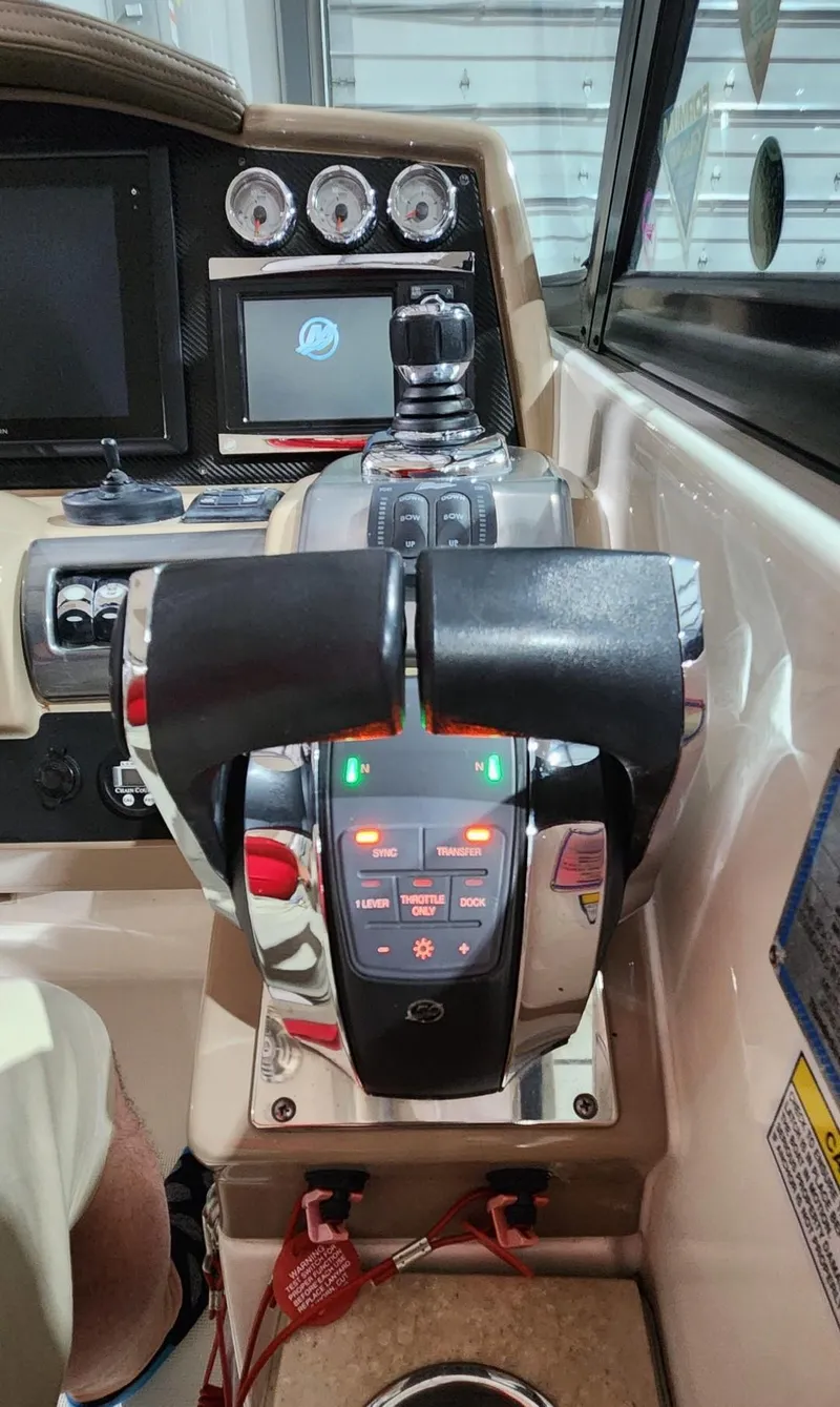 Slide: The Image of 2015 Formula 350 CBR boat control panel with throttle and navigation displays. - 16