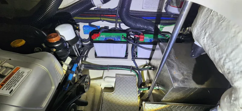 Slide: The Image of Engine compartment of a 2015 Formula 350 CBR boat with batteries and wiring. - 25