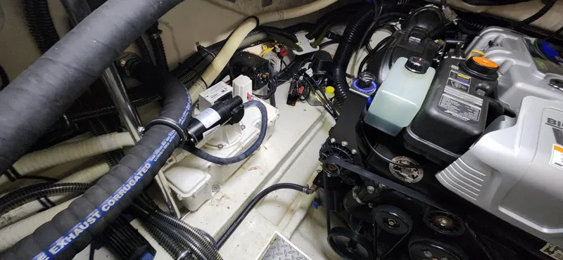 Slide: The Image of Engine compartment of a 2015 Formula 350 CBR boat with visible components and wiring. - 27