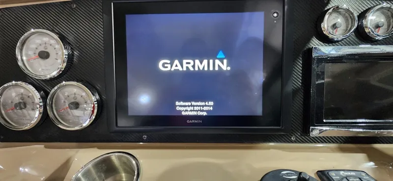 Slide: The Image of Garmin navigation system on 2015 Formula 350 CBR boat dashboard with gauges. - 32