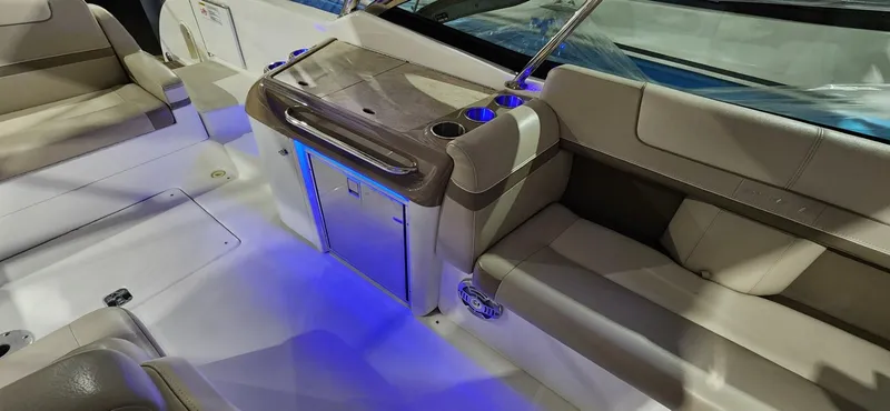 Slide: The Image of 2015 Formula 350 CBR boat interior with seating and blue LED lighting. - 34