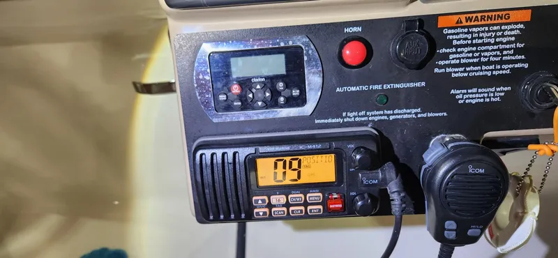 Slide: The Image of Control panel of a 2015 Formula 350 CBR boat with radio and safety features. - 36