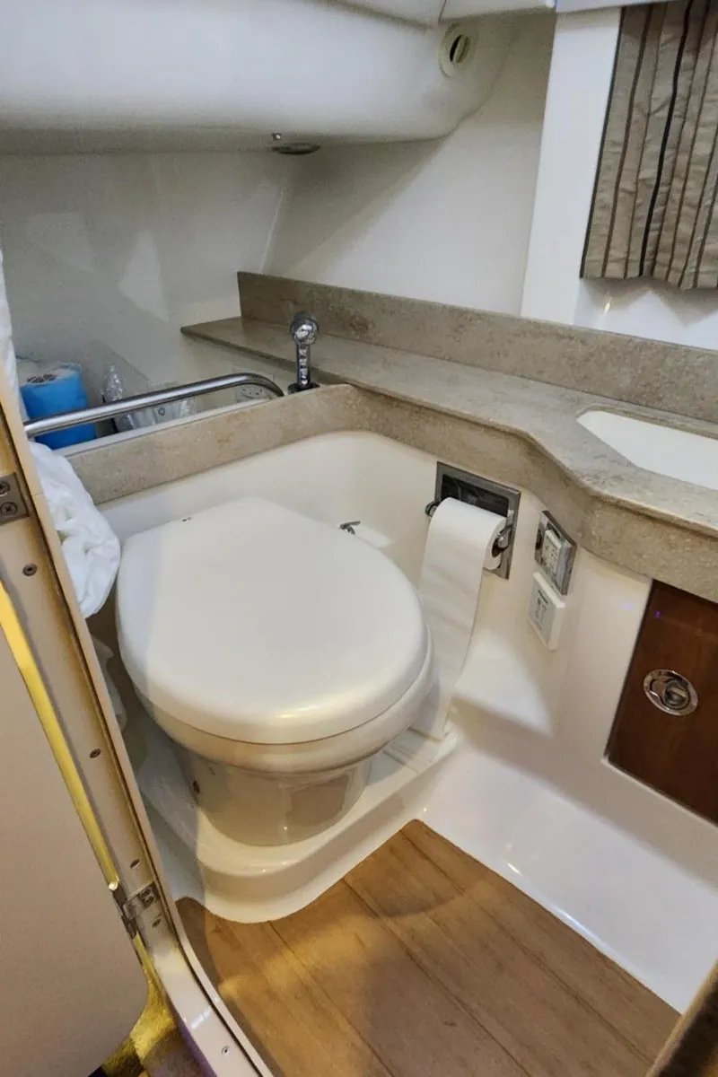 Slide: The Image of 2015 Formula 350 CBR boat bathroom with modern fixtures and wooden flooring. - 46