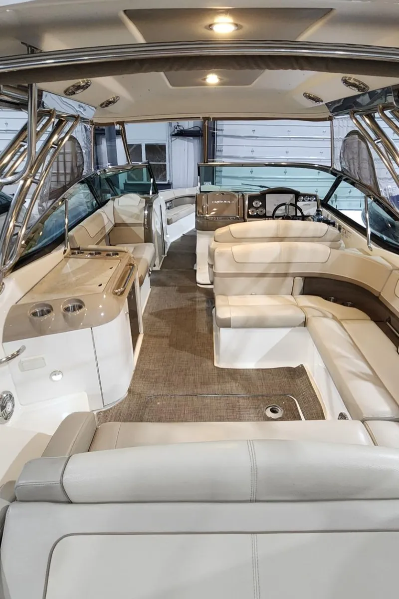 Slide: The Image of Interior of a 2015 Formula 350 CBR boat with luxurious seating and modern amenities. - 49