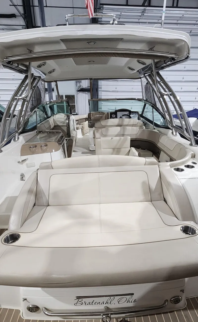 Slide: The Image of 2015 Formula 350 CBR boat interior with beige seating and canopy. - 7