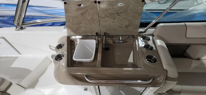 Slide: The Image of 2015 Formula 350 CBR boat interior sink and countertop with cup holders. - 9