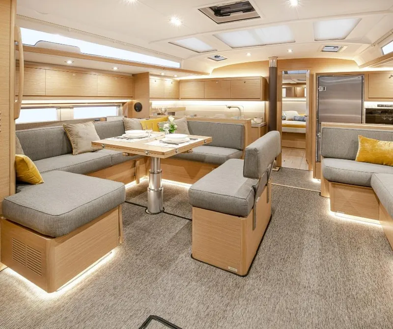 Slide: The Image of Luxurious interior of 2024 Dufour 530 yacht with modern seating and elegant lighting. - 4