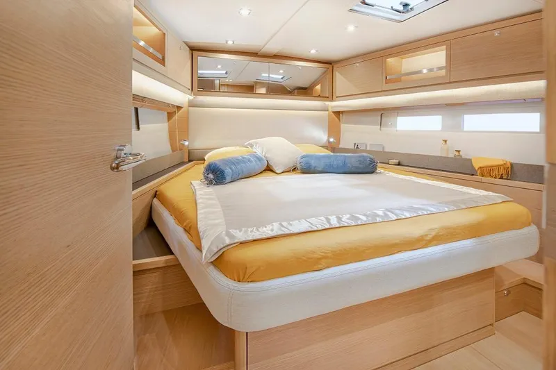 Slide: The Image of Luxurious cabin interior of 2024 Dufour 530 yacht with cozy bedding and modern design. - 7