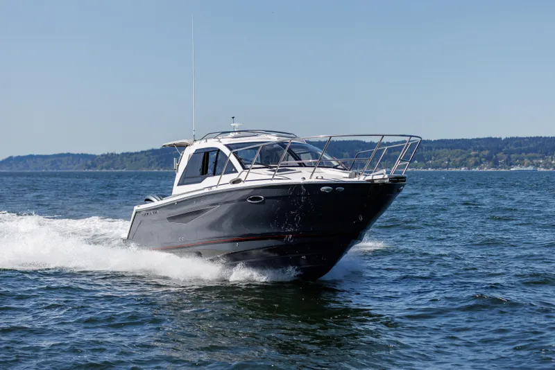 Slide: The Image of 2024 Solara S-250 C boat cruising on open water. - 0
