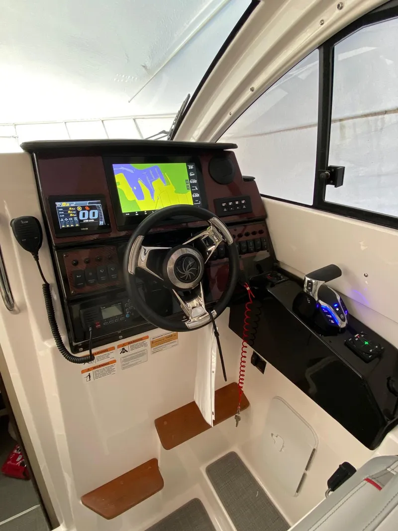 Slide: The Image of 2024 Solara S-250 C boat cockpit with advanced navigation system and controls. - 16