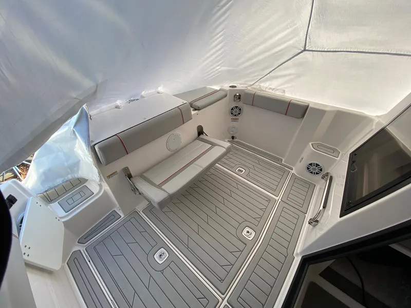 Slide: The Image of 2024 Solara S-250 C boat interior with cushioned seating and modern design. - 2