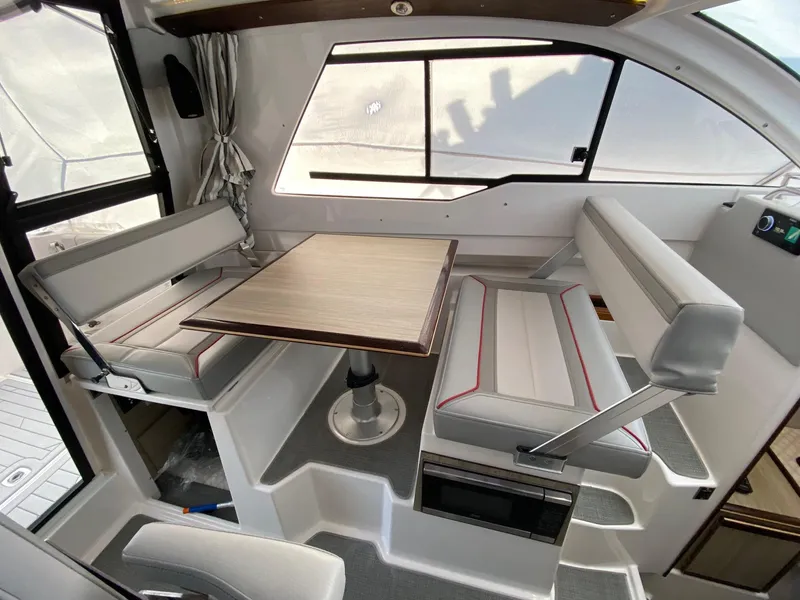 Slide: The Image of 2024 Solara S-250 C interior dining area with modern seating and table. - 8