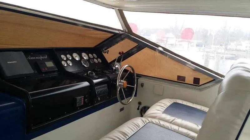 Slide: The Image of Interior of 1988 Chris-Craft 412 yacht with steering wheel and control panel. - 15