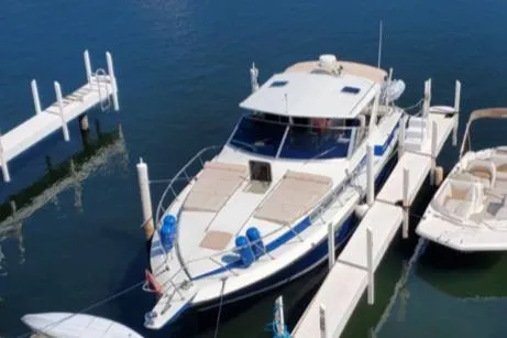 Slide: The Image of 1988 Chris-Craft 412 yacht docked at marina. - 7