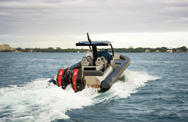 Slide: The Image of 2024 Skipper-BSK 38 boat cruising on open water with twin engines. - 18