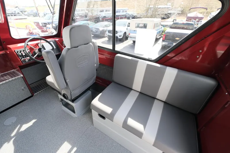 Slide: The Image of Interior of 2024 Hewescraft 220 Ocean Pro ET HT boat with seating and steering area. - 10