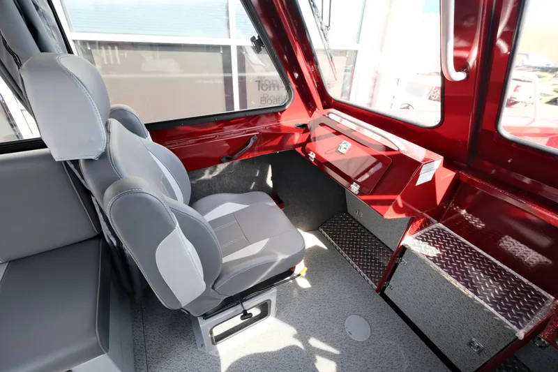 Slide: The Image of Interior of 2024 Hewescraft 220 Ocean Pro ET HT, featuring seating and dashboard. - 13