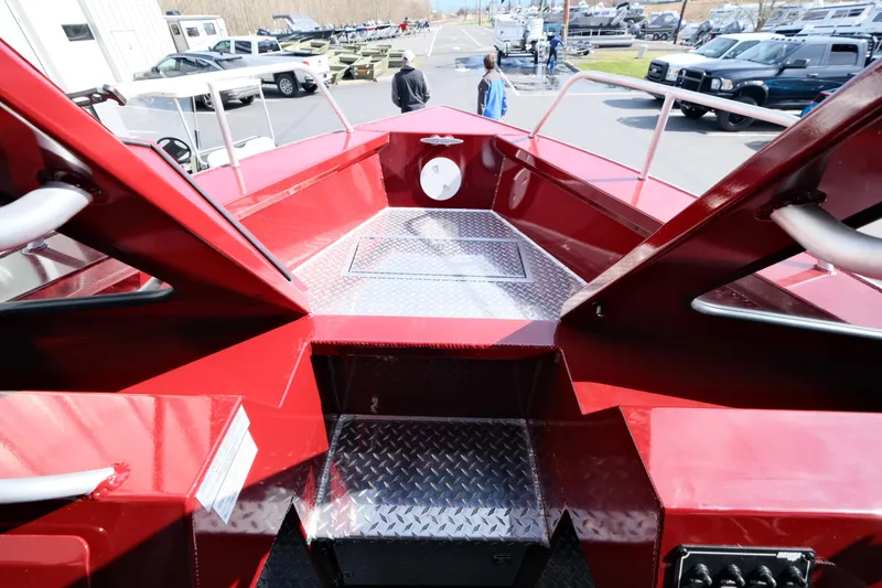 Slide: The Image of 2024 Hewescraft 220 Ocean Pro ET HT boat deck with red finish and diamond plate flooring. - 14