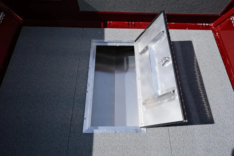 Slide: The Image of 2024 Hewescraft 220 Ocean Pro ET HT open storage compartment. - 16