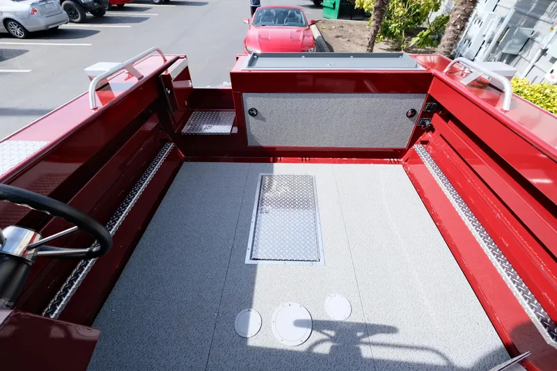 Slide: The Image of 2024 Hewescraft 220 Ocean Pro ET HT boat interior, red and gray finish. - 5