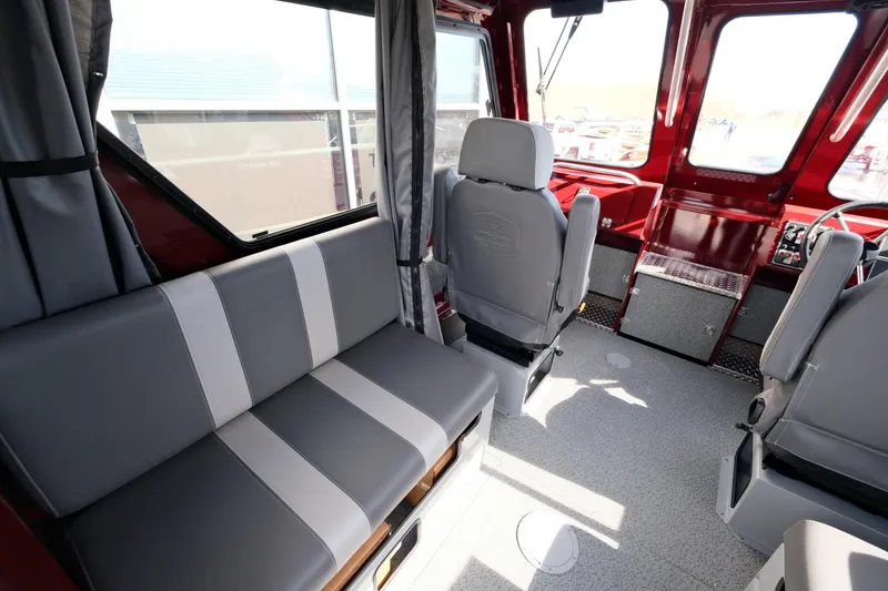 Slide: The Image of Interior of 2024 Hewescraft 220 Ocean Pro ET HT, featuring seating and helm area. - 7