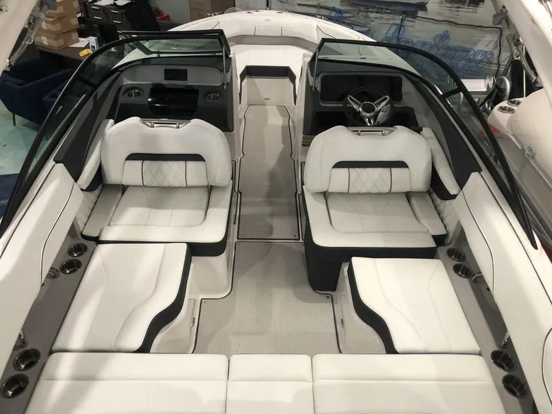 Slide: The Image of 2024 Regal LS2 boat interior with luxurious white seating and modern dashboard design. - 2