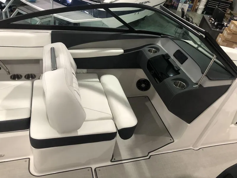 Slide: The Image of 2024 Regal LS2 boat interior with white seating and modern dashboard design. - 3