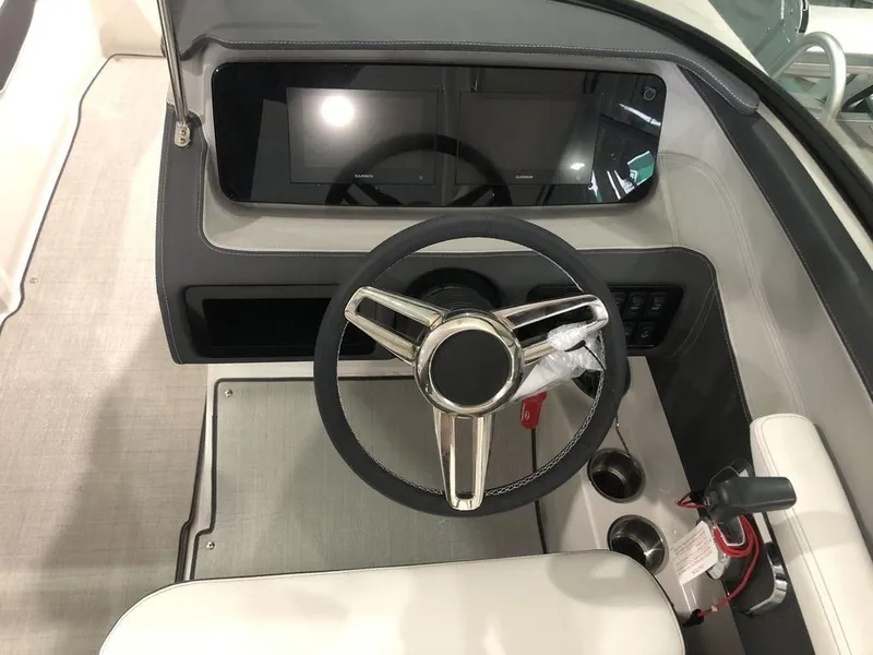 Slide: The Image of 2024 Regal LS2 boat dashboard with steering wheel and modern controls. - 5