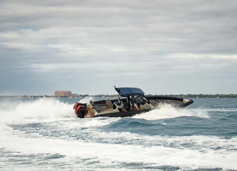 Slide: The Image of 2024 Skipper-BSK 38 boat cruising on open water. - 2