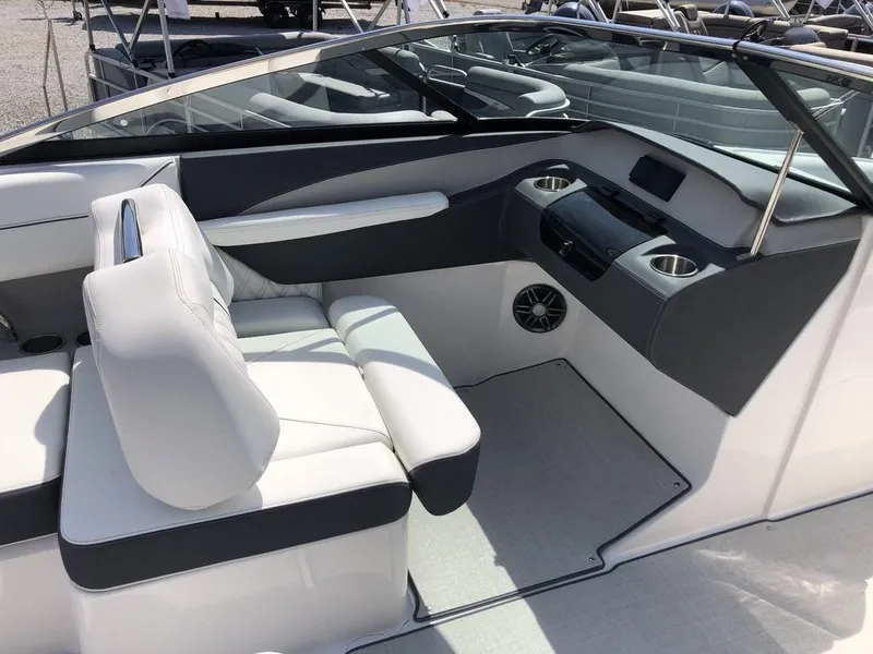 Slide: The Image of 2024 Regal LS4 boat interior with sleek seating and modern dashboard design. - 3