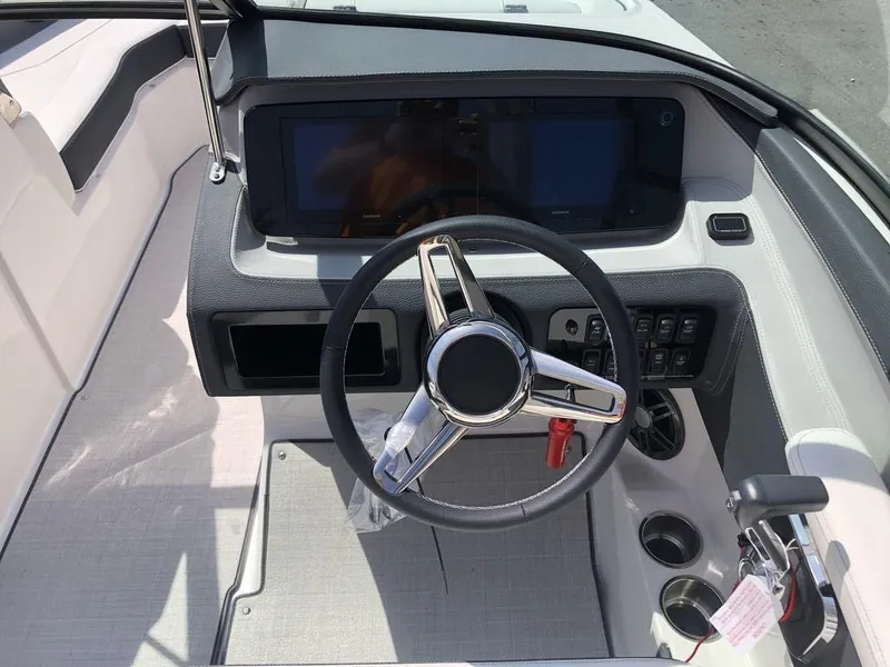 Slide: The Image of 2024 Regal LS4 boat dashboard with steering wheel and control panel. - 5