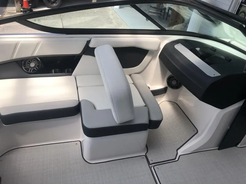 Slide: The Image of Interior of 2025 Regal 2000 ES boat with modern seating and dashboard design. - 3