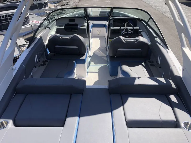 Slide: The Image of 2025 Regal LS2 Ultimate boat interior with sleek seating and modern dashboard design. - 3