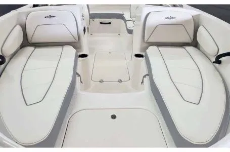 Slide: The Image of 2023 Stingray 172SC boat interior with white cushioned seating. - 3